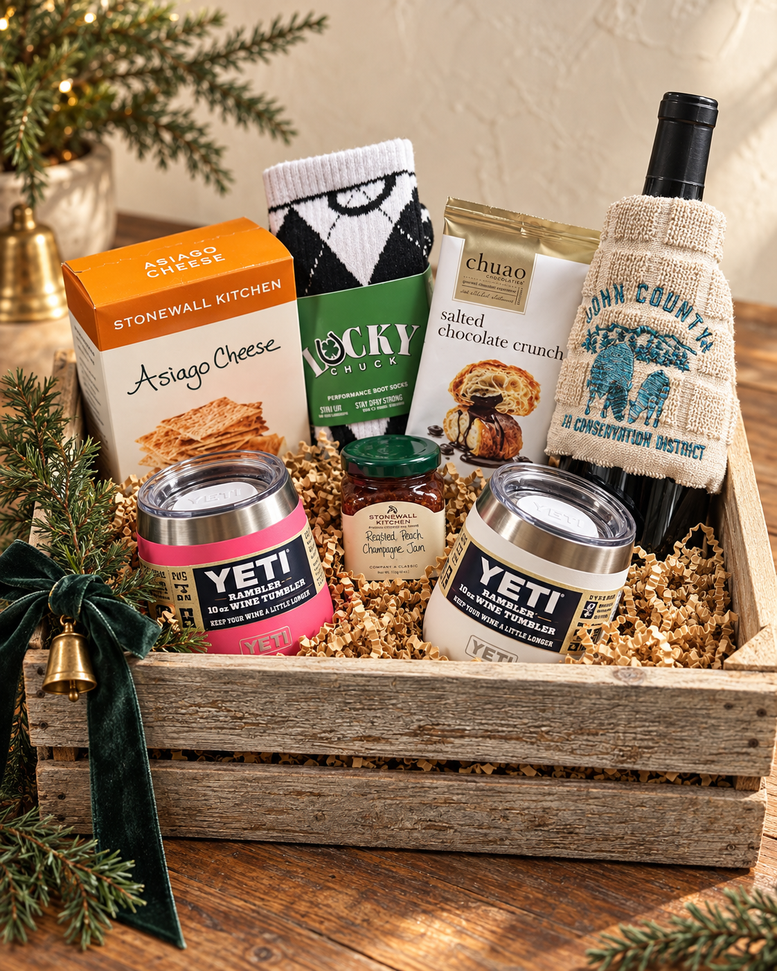 Rustic holiday wine gift crate with tumblers and treats
